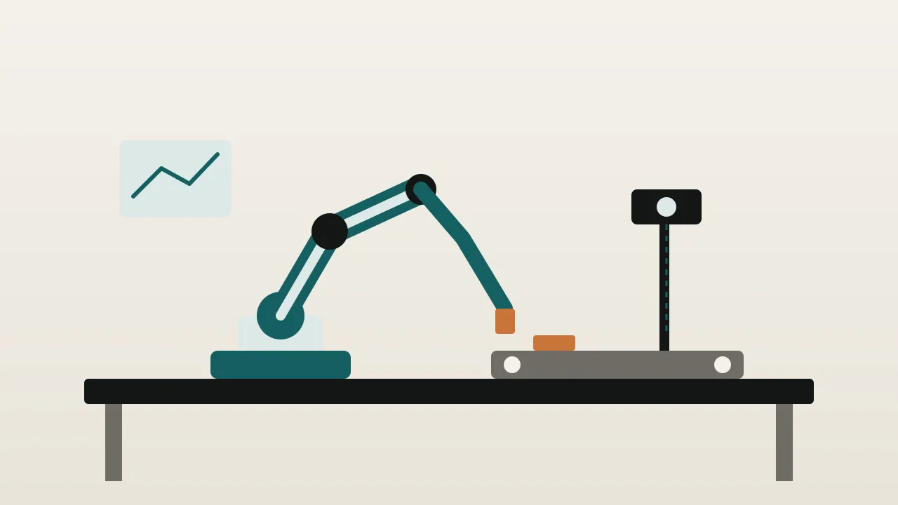 A desktop robot arm on a classroom bench beside a conveyor and a camera on a stand